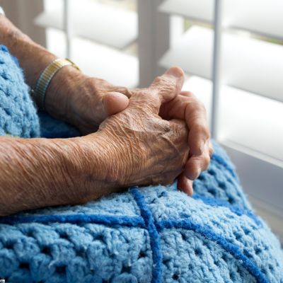 Hands on blue blanket